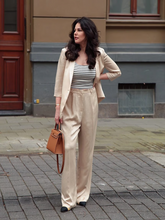 A woman wears a blazer